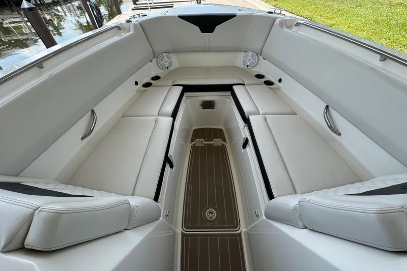 Slide: The Image of Interior of 2021 Sailfish 276 DC boat with white seating and wood flooring. - 19