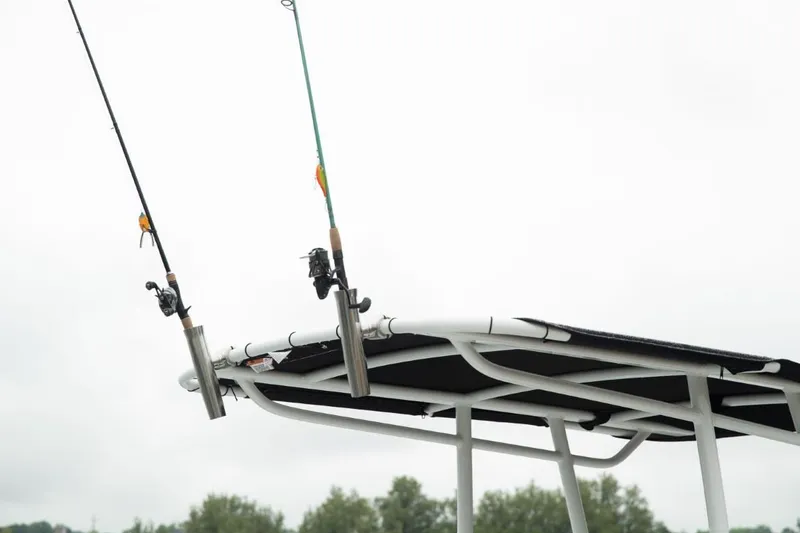 Slide: The Image of Fishing rods on Wellcraft 2025 202 Fisherman boat, cloudy sky background. - 22