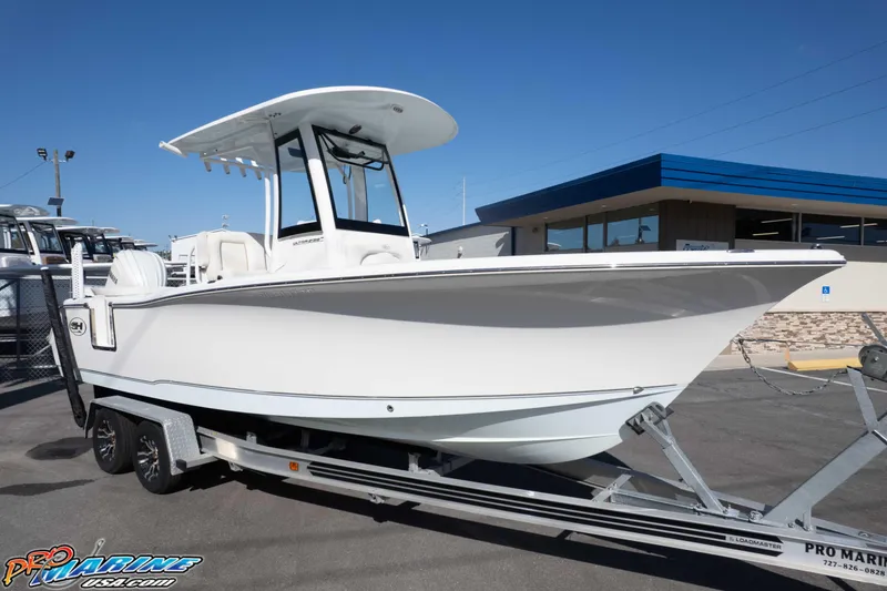 Slide: The Image of 2022 Sea Hunt Ultra 239 SE boat on trailer at dealership. - 11