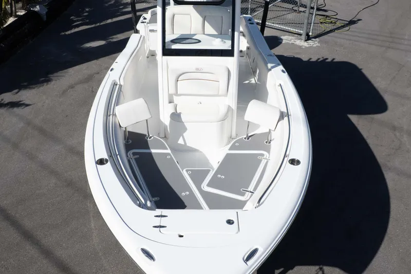 Slide: The Image of 2022 Sea Hunt Ultra 239 SE boat, top view of spacious deck and seating area. - 13