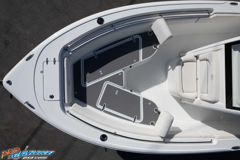 Slide: The Image of 2022 Sea Hunt Ultra 239 SE boat interior with cushioned seating and storage compartments. - 14