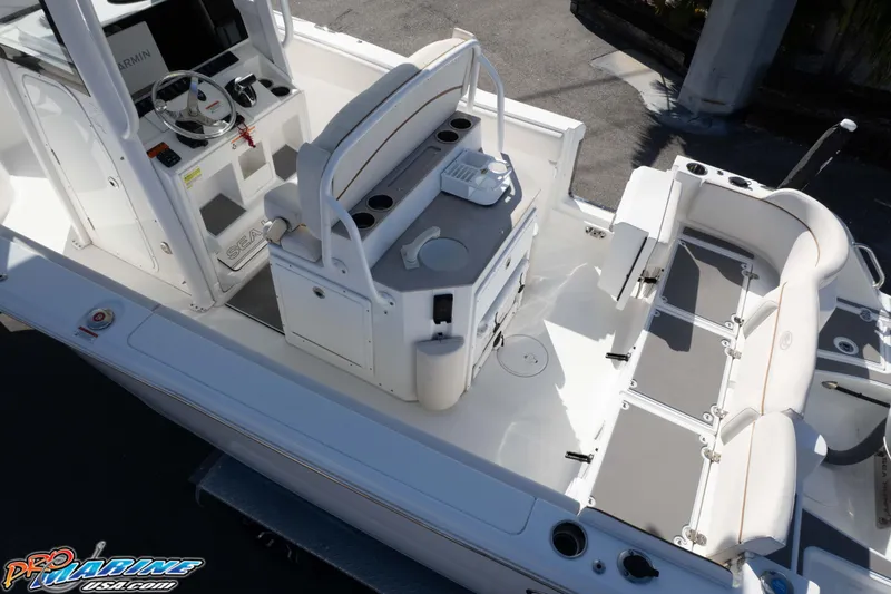 Slide: The Image of 2022 Sea Hunt Ultra 239 SE boat interior with seating and console. - 16