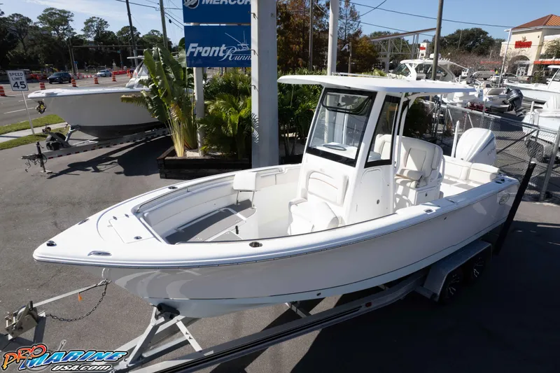 Slide: The Image of 2022 Sea Hunt Ultra 239 SE boat on trailer at dealership. - 2