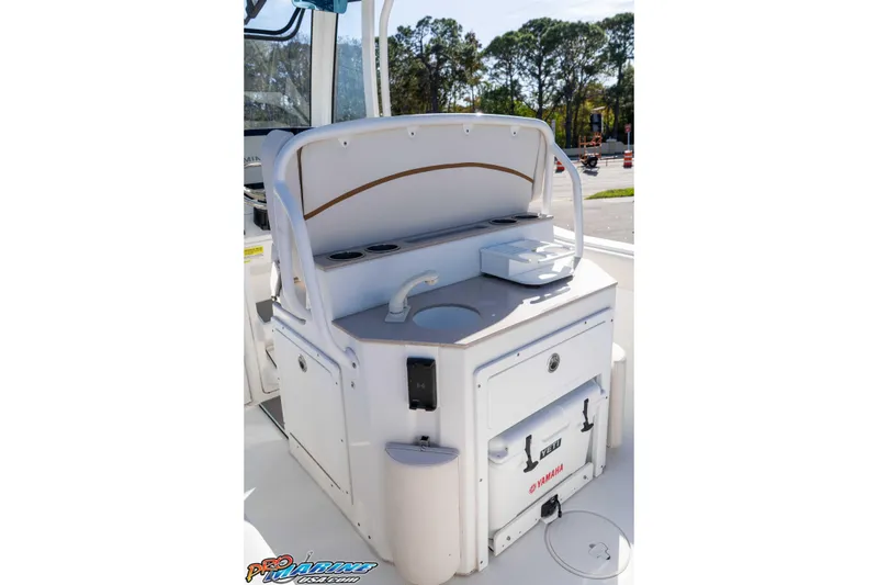 Slide: The Image of 2022 Sea Hunt Ultra 239 SE boat console with sink and storage compartments. - 20