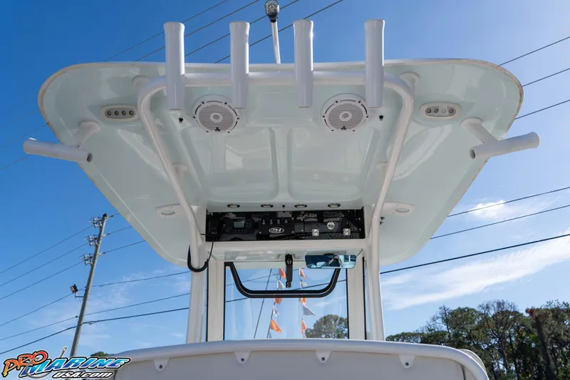 Slide: The Image of 2022 Sea Hunt Ultra 239 SE boat T-top with rod holders and speakers. - 24
