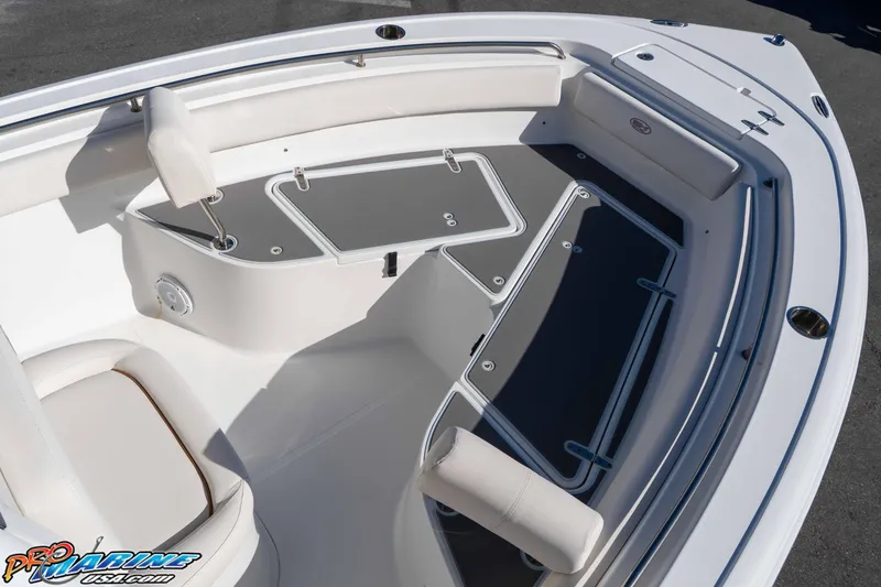 Slide: The Image of 2022 Sea Hunt Ultra 239 SE boat interior with seating and storage compartments. - 27
