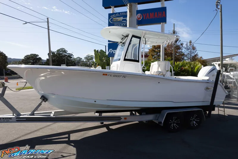 Slide: The Image of 2022 Sea Hunt Ultra 239 SE boat on trailer at dealership. - 3