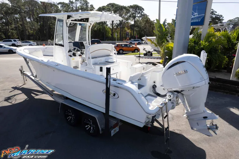 Slide: The Image of 2022 Sea Hunt Ultra 239 SE boat on trailer, featuring Yamaha outboard motor. - 4