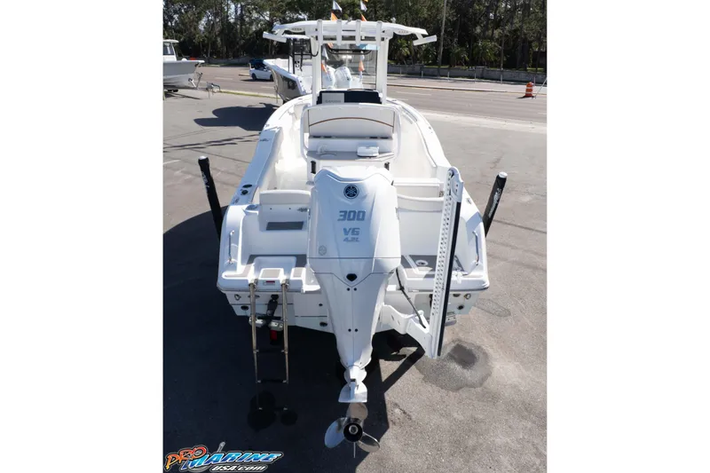 Slide: The Image of 2022 Sea Hunt Ultra 239 SE boat with powerful 300 V6 engine, parked outdoors. - 5