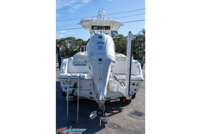 Slide: The Image of 2022 Sea Hunt Ultra 239 SE boat rear view with powerful outboard motor. - 6