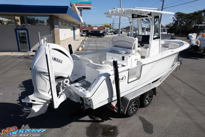 Slide: The Image of 2022 Sea Hunt Ultra 239 SE boat with Yamaha engine on trailer in parking lot. - 9