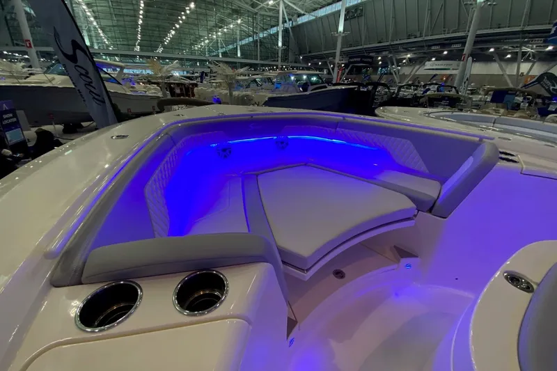 Slide: The Image of Luxurious seating area with blue LED lighting on 2026 Scout 357 LXF boat. - 13