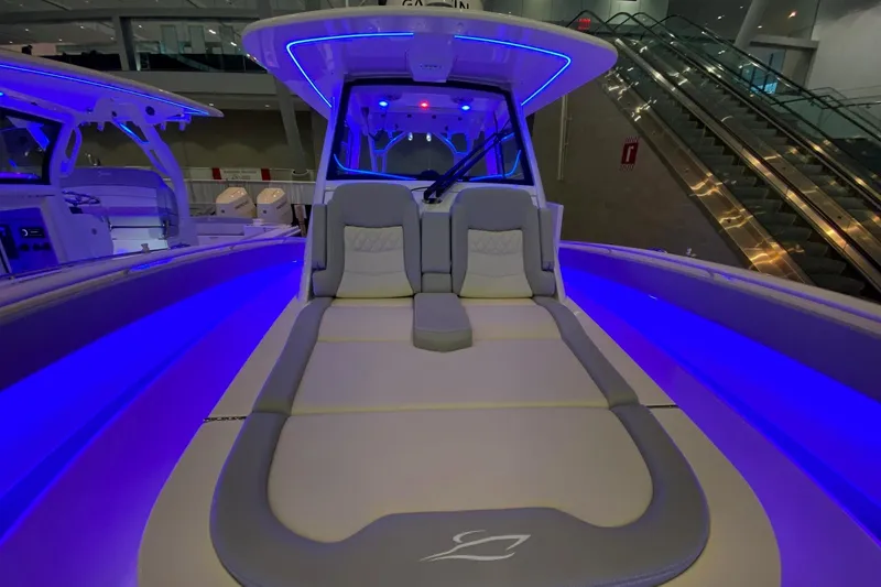 Slide: The Image of 2026 Scout 357 LXF boat interior with blue LED lighting and luxurious seating. - 15