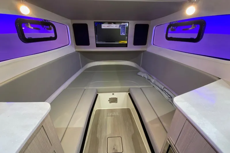 Slide: The Image of Luxurious interior of 2026 Scout 357 LXF boat with modern seating and ambient lighting. - 16