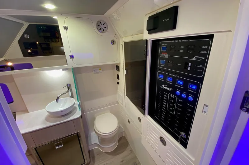 Slide: The Image of Luxurious 2026 Scout 357 LXF boat interior with modern bathroom and control panel. - 18
