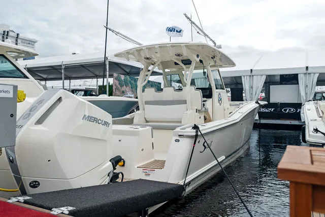 Slide: The Image of Luxurious 2026 Scout 357 LXF boat interior with modern bathroom and control panel. - 22