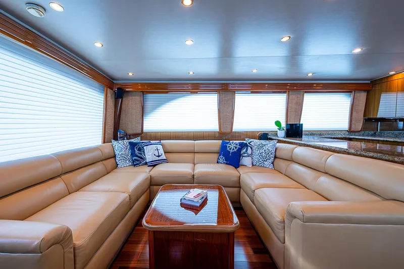 Slide: The Image of Luxurious interior of 2007 Viking 64 Convertible yacht with beige leather seating and nautical decor. - 10