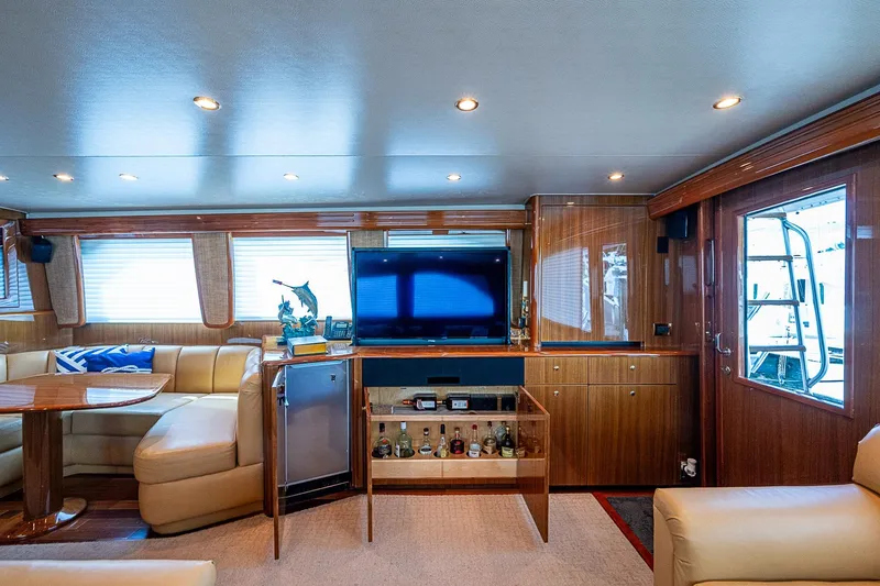 Slide: The Image of Luxurious interior of a 2007 Viking 64 Convertible yacht with elegant seating and entertainment area. - 11