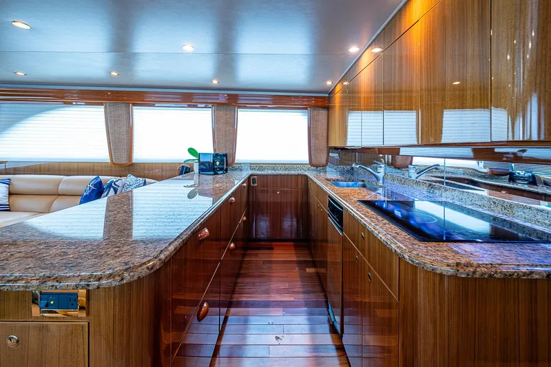 Slide: The Image of Luxurious kitchen interior of 2007 Viking 64 Convertible yacht with granite countertops. - 12