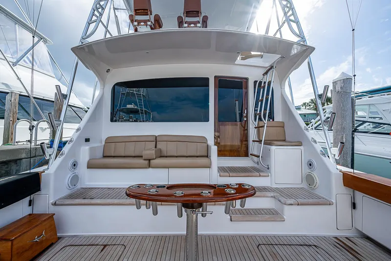 Slide: The Image of 2007 Viking 64 Convertible yacht with spacious deck and seating area. - 25