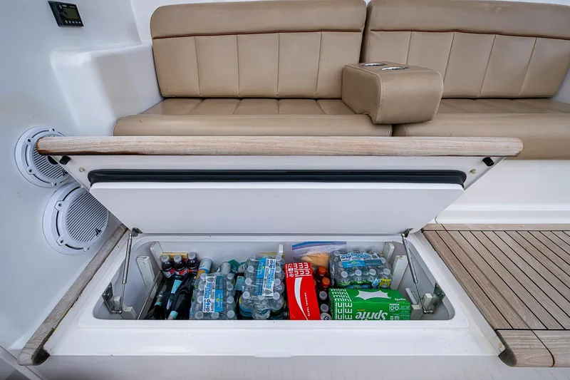 Slide: The Image of Built-in cooler on 2007 Viking 64 Convertible yacht, stocked with drinks and snacks. - 29