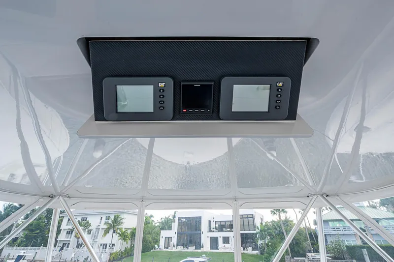Slide: The Image of 2007 Viking 64 Convertible yacht dashboard with dual CAT displays. - 36
