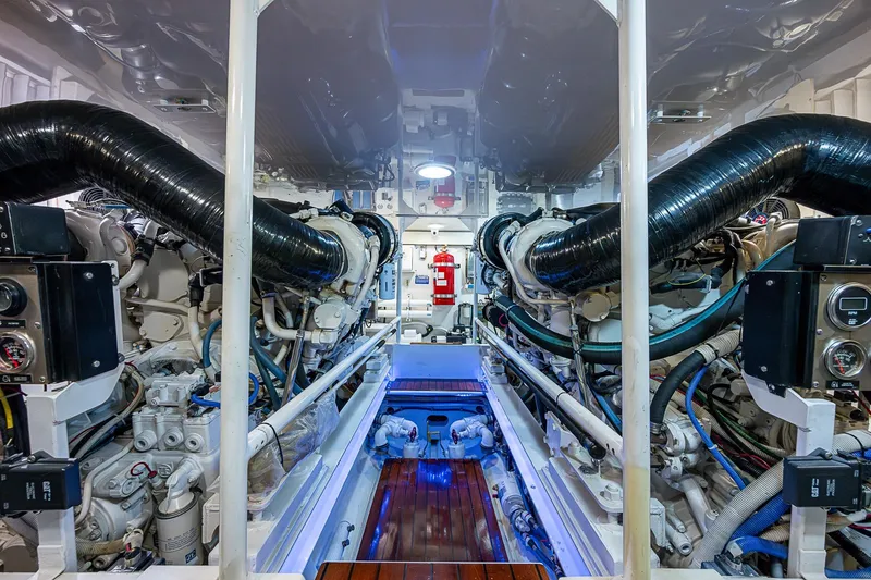 Slide: The Image of Engine room of a 2007 Viking 64 Convertible yacht, showcasing dual engines and equipment. - 42