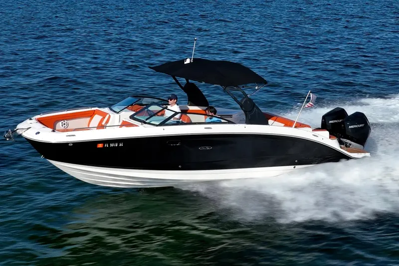 The Image of 2019 Sea Ray SDX 290 Outboard cruising on open water, featuring sleek design and powerful engines. - 0