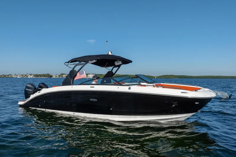 Slide: The Image of 2019 Sea Ray SDX 290 Outboard boat cruising on a sunny day. - 15