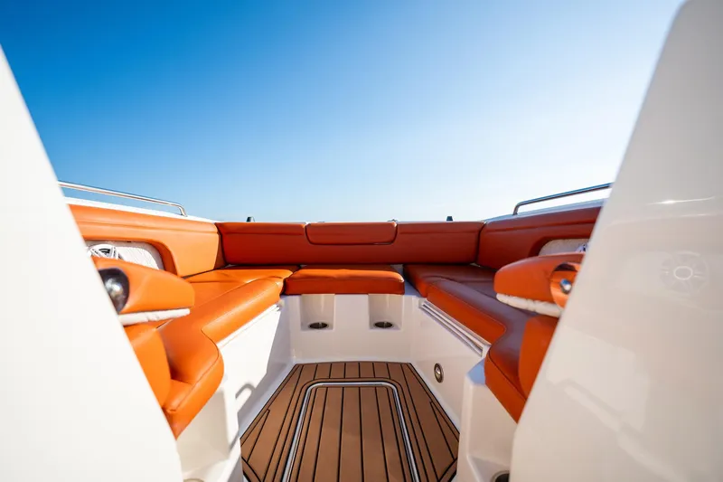 Slide: The Image of 2019 Sea Ray SDX 290 Outboard boat with orange seating and teak flooring. - 19