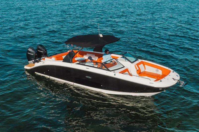 Slide: The Image of 2019 Sea Ray SDX 290 Outboard boat cruising on open water. - 2