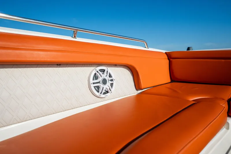 Slide: The Image of 2019 Sea Ray SDX 290 Outboard with orange seating and speaker detail. - 21