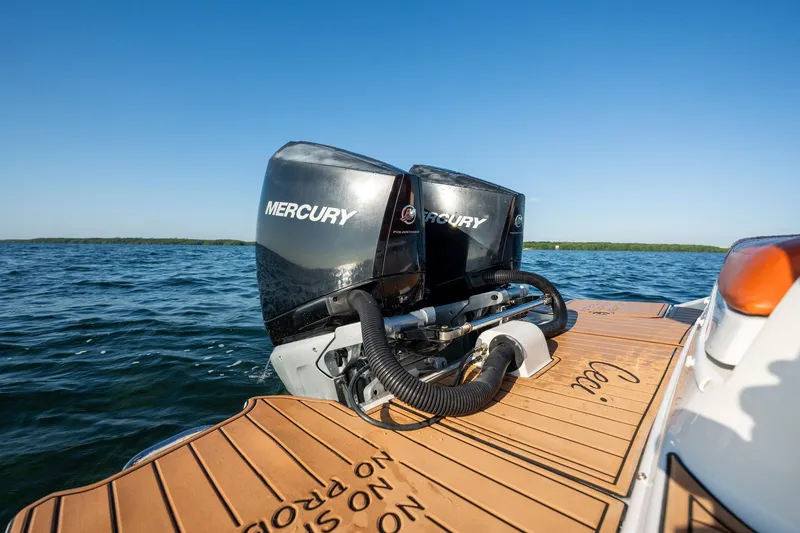 Slide: The Image of 2019 Sea Ray SDX 290 Outboard with dual Mercury engines on open water. - 28