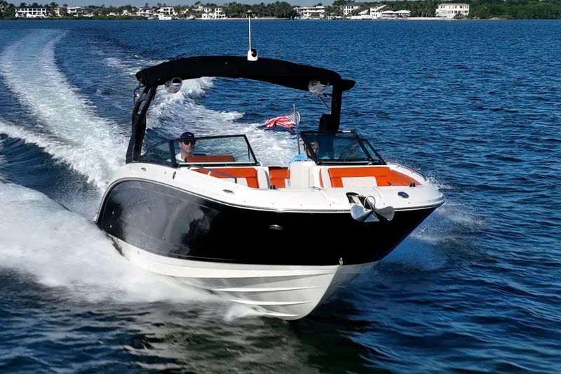 Slide: The Image of 2019 Sea Ray SDX 290 Outboard cruising on blue water, showcasing sleek design and performance. - 3