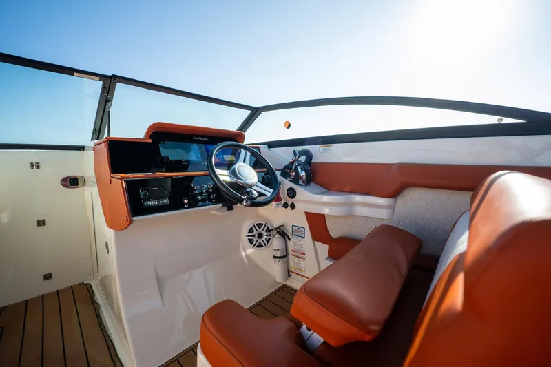 Slide: The Image of 2019 Sea Ray SDX 290 Outboard helm with leather seats and modern controls. - 32