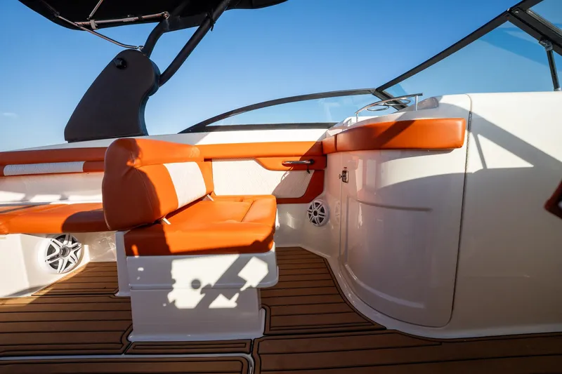 Slide: The Image of 2019 Sea Ray SDX 290 Outboard interior with orange seating and sleek design. - 33