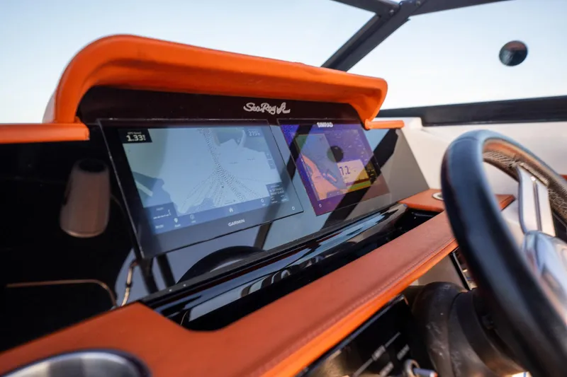 Slide: The Image of 2019 Sea Ray SDX 290 Outboard dashboard with Garmin navigation display. - 41