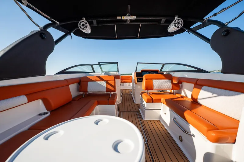 Slide: The Image of 2019 Sea Ray SDX 290 Outboard interior with orange seating and sleek design. - 48