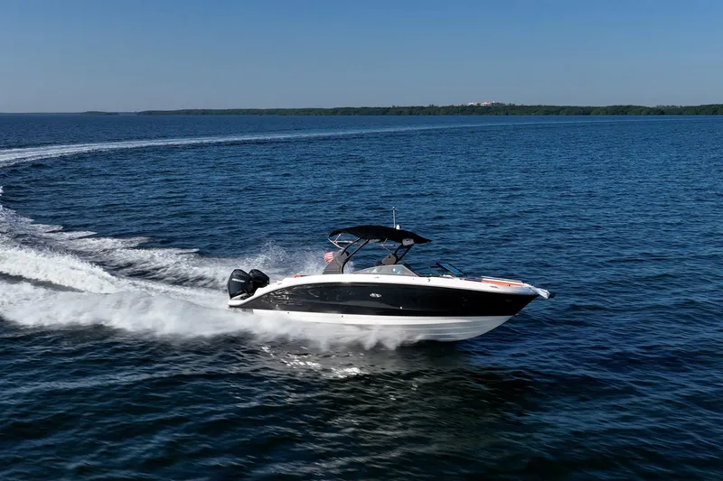 Slide: The Image of 2019 Sea Ray SDX 290 Outboard cruising on open water, creating a dynamic wake. - 49
