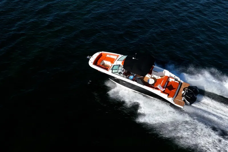 Slide: The Image of 2019 Sea Ray SDX 290 Outboard cruising on open water, top view. - 50