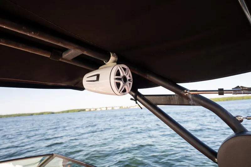 Slide: The Image of Speaker mounted on 2019 Sea Ray SDX 290 Outboard boat, overlooking water. - 64