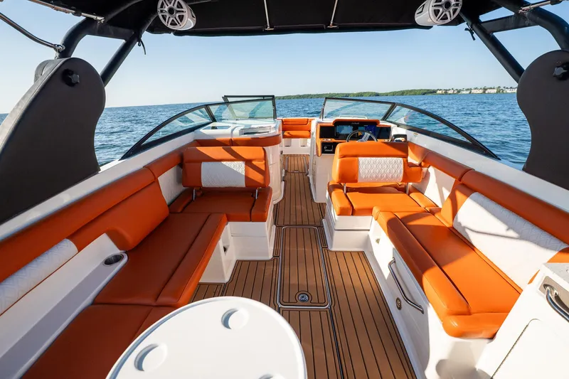 Slide: The Image of 2019 Sea Ray SDX 290 Outboard boat with orange seating, spacious deck, and ocean view. - 68