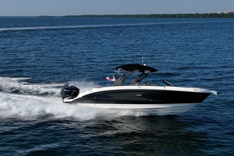 Slide: The Image of 2019 Sea Ray SDX 290 Outboard cruising on open water. - 75