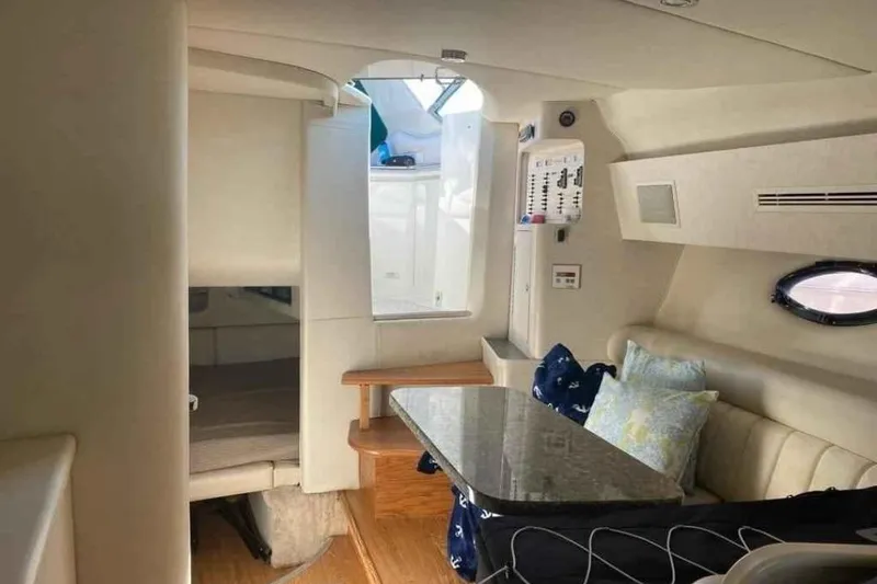 Slide: The Image of Interior of 1997 Regal Commodore 3260 yacht with seating and table. - 9