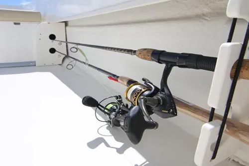 Slide: The Image of Manufacturer Provided Image: 2025 Sundance B22CCR boat with open storage compartment, beige seating, and outboard motor on water. - 11