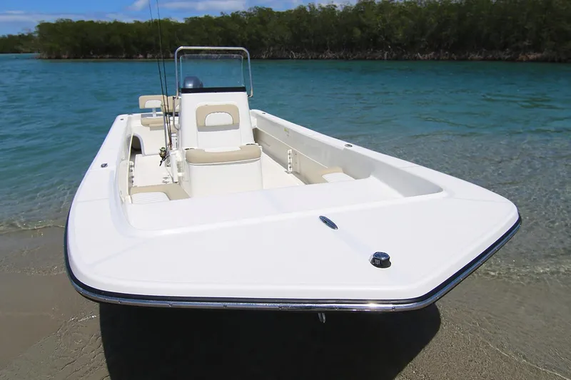 Slide: The Image of Manufacturer Provided Image: A 2025 Sundance B22CCR boat with Yamaha engine cruising on calm water. - 4