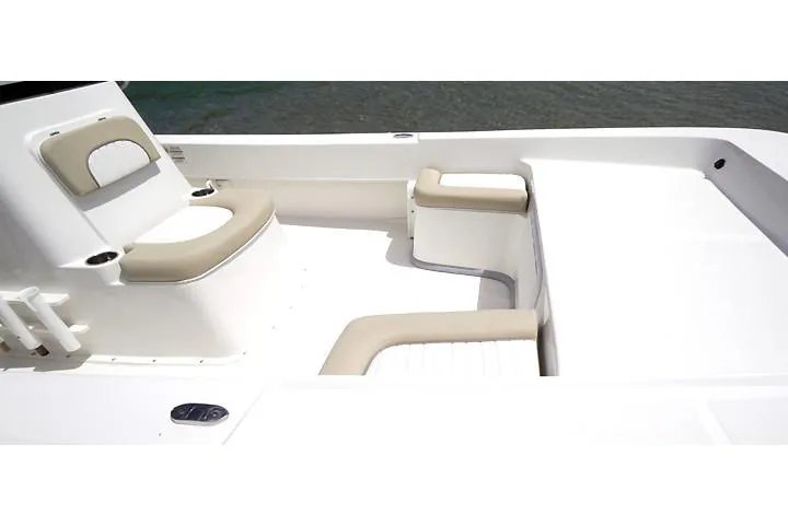 Slide: The Image of Manufacturer Provided Image: 2025 Sundance B22CCR boat cruising on a lake with two people onboard. - 5