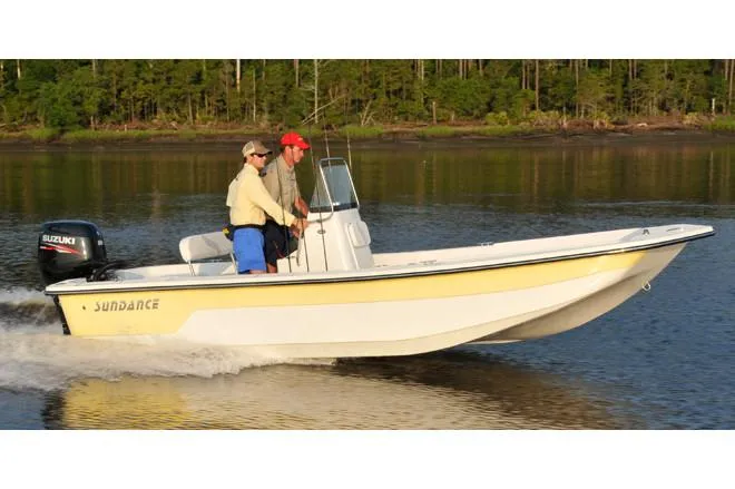 The Image of Manufacturer Provided Image: 2025 Sundance B20CCR boat with Suzuki engine on a calm lake. - 2