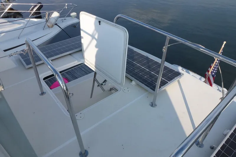 Slide: The Image of Deck of 2009 Maine Cat P-47 with solar panels and open hatch. - 10