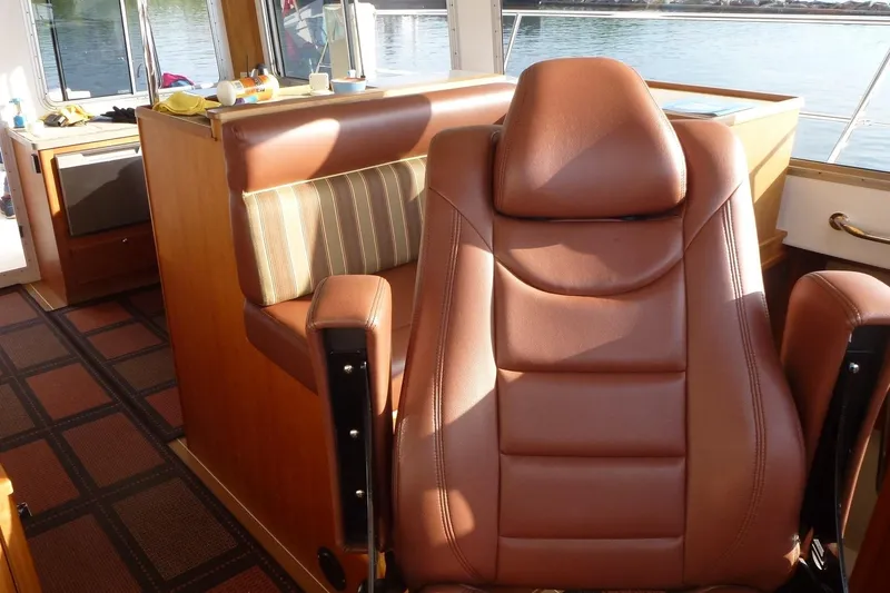 Slide: The Image of Luxurious interior of a 2009 Maine Cat P-47 with leather seating and wood accents. - 18